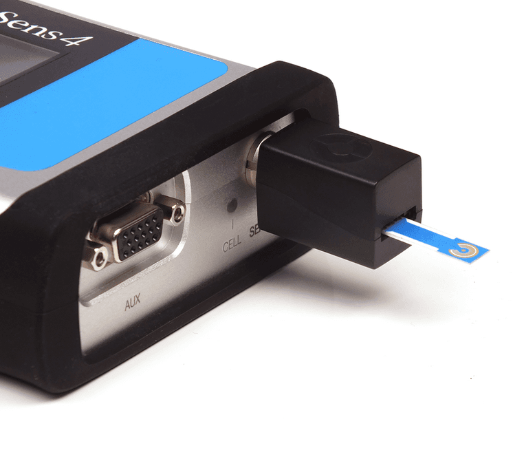 Amperometric glucose sensor strip inserted into potentiostat reader